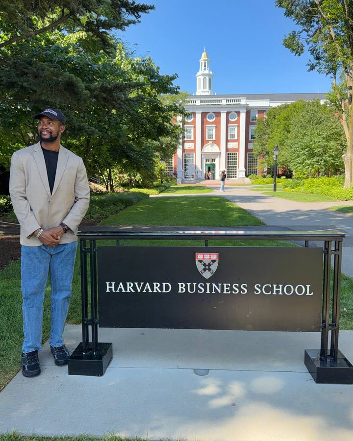 Festus Iyorah beside the Harvard Business School sign