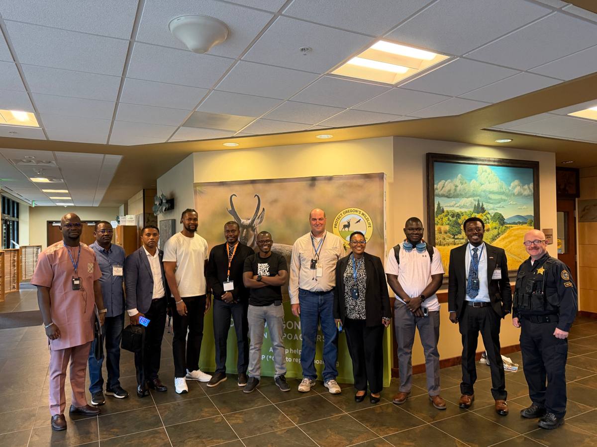 The IVLP delegation with officers at a Protect Oregon’s Wildlife display